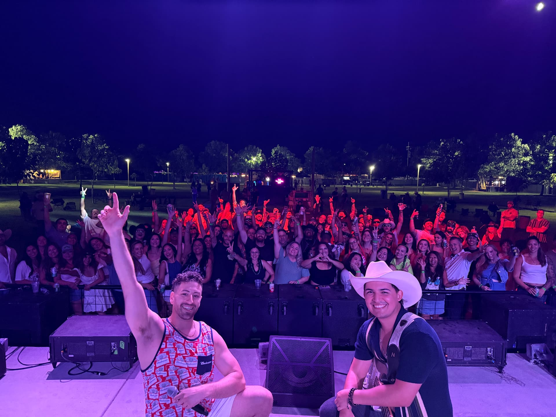 Jordan Miller and Kristian Cruz on stage with the ApCal Rock N' Ranch crowd in Fresno