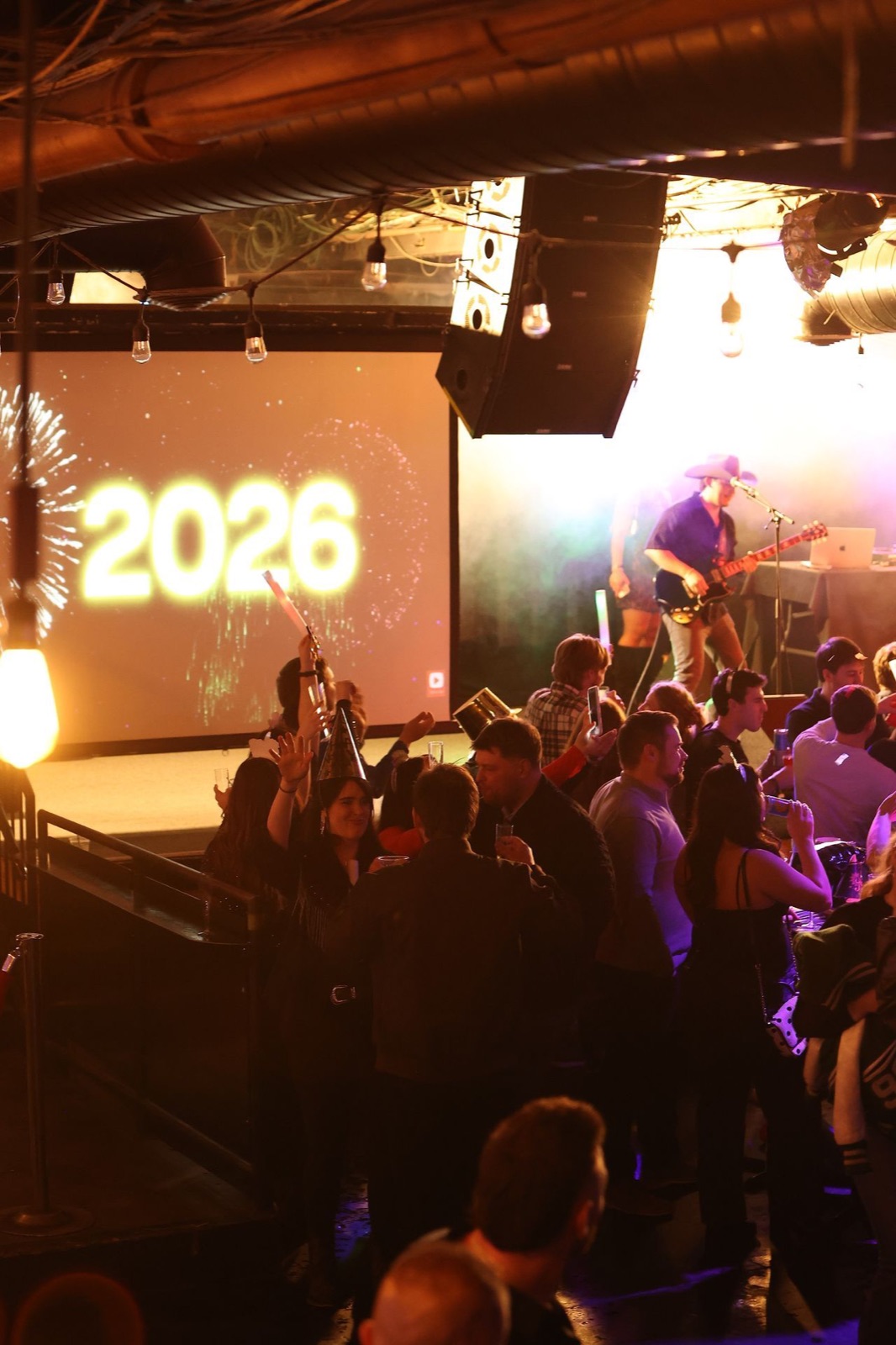 New Year's Eve at Joe's on Weed St. in Chicago with 2026 on the LED wall