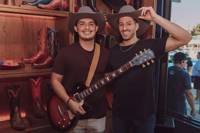 Kristian Cruz on guitar with Jordan Miller inside the Lucchese boot store