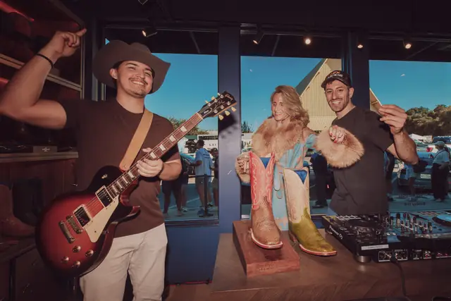 Kristian Cruz playing live guitar at the Lucchese F1 Weekend pop-up