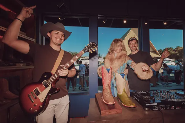 Kristian Cruz playing live guitar at the Lucchese F1 Weekend pop-up