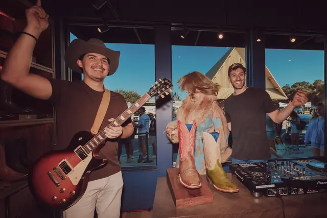 Kristian Cruz playing live guitar at the Lucchese F1 Weekend pop-up