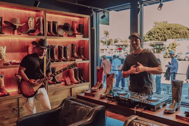 Kristian Cruz playing live guitar at the Lucchese F1 Weekend pop-up