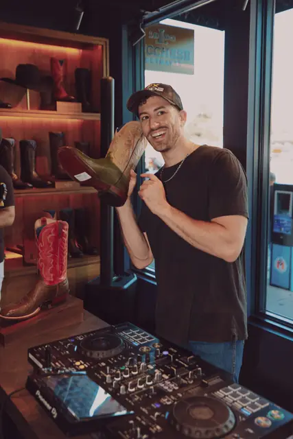 Jordan Miller DJing at the Lucchese F1 Weekend pop-up