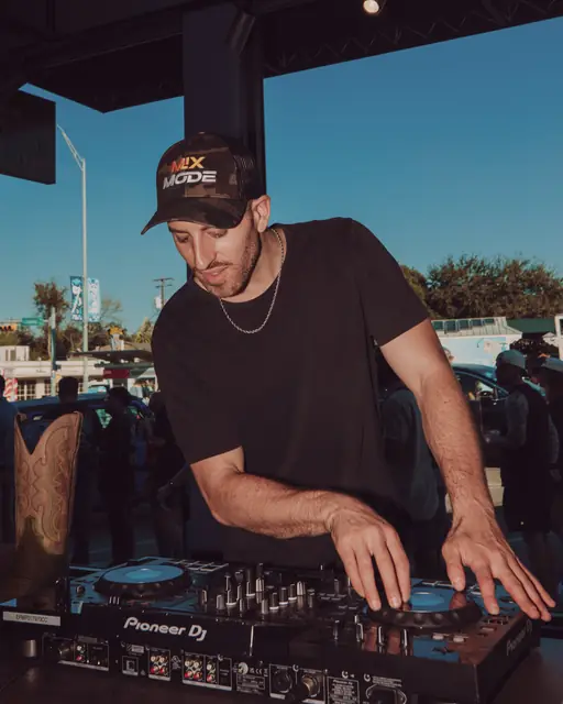 Jordan Miller DJing at the Lucchese F1 Weekend pop-up