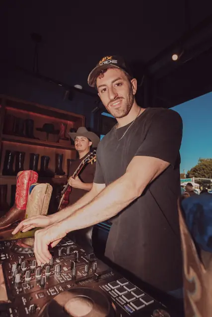 Jordan Miller DJing at the Lucchese F1 Weekend pop-up