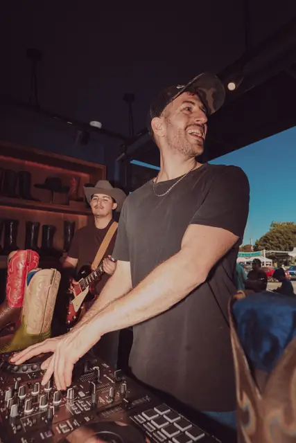 Jordan Miller DJing at the Lucchese F1 Weekend pop-up