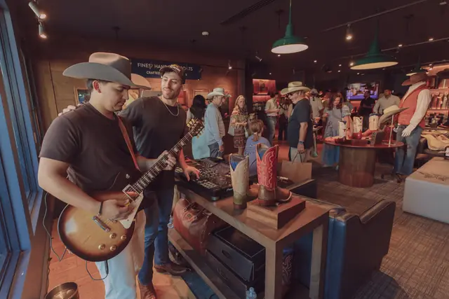 Guests at the MIXMODE set during the Lucchese F1 Weekend pop-up on South Congress