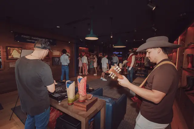 Guests at the MIXMODE set during the Lucchese F1 Weekend pop-up on South Congress