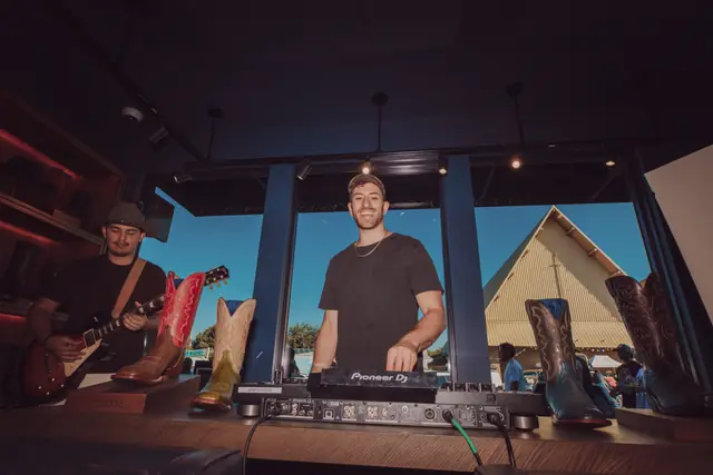 Guests at the MIXMODE set during the Lucchese F1 Weekend pop-up on South Congress