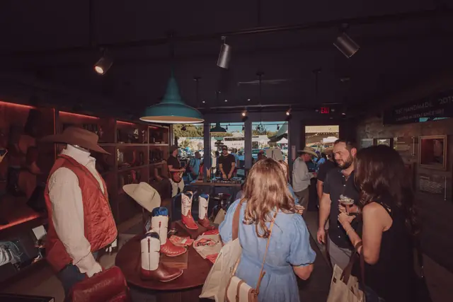 Guests at the MIXMODE set during the Lucchese F1 Weekend pop-up on South Congress