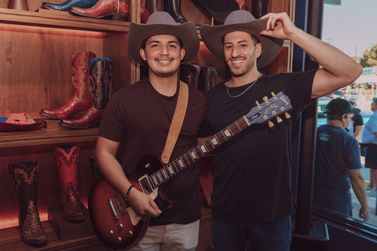 Kristian Cruz on guitar with Jordan Miller of MIXMODE inside the Lucchese boot store on South Congress